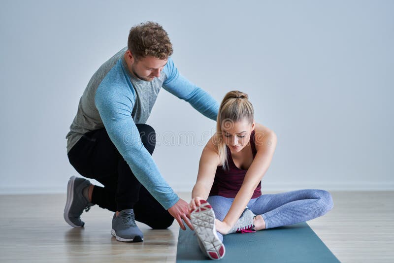 Woman with her personal fitness trainer stock image Woman with her personal fitness trainer stock image