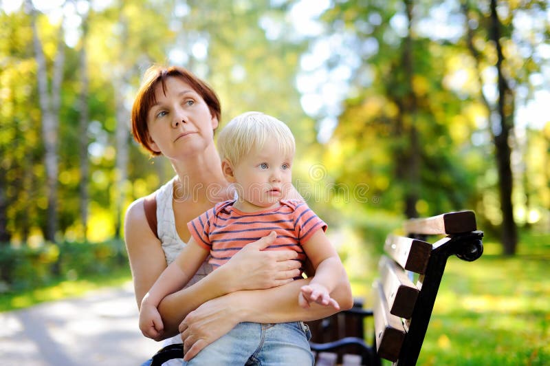 Woman and her toddler grandson enjoy sunny autumn day royalty free stock photos Woman and her toddler grandson enjoy sunny autumn day royalty free stock photos