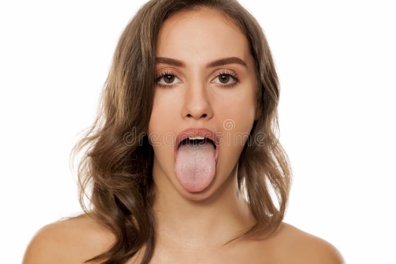 Young beautiful woman with her tongue sticking out stock photos.