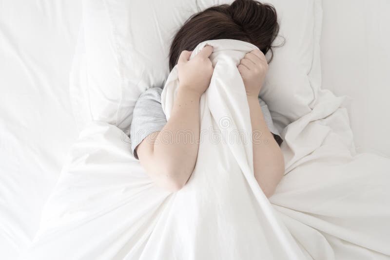 Scared Woman Hiding Her Face Under The Sheet Stock Image I
