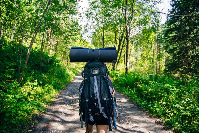 Woman Hiker in Hike with a Big Backpack Back View Editorial Stock Image