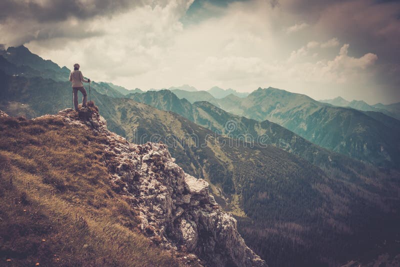 Woman hiker on a top of a mountain. Woman hiker on a top of a mountain