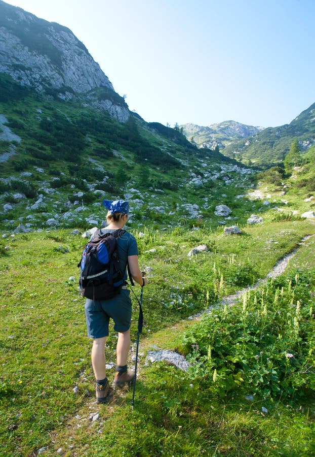 Woman hiking in alps stock images