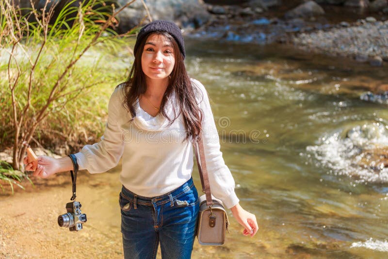 Woman hiking around mountains near the river at spring time. stock image Woman hiking around mountains near the river at spring time. stock image