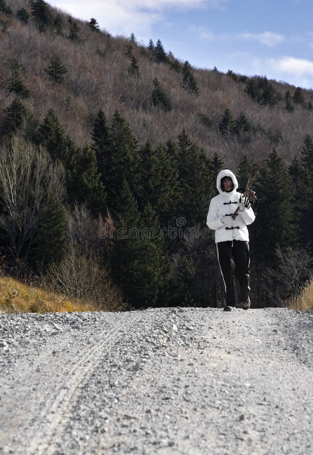 Woman hiking on a country road