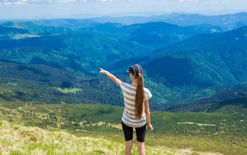 Woman hiking pointing to the sky enjoy the beautiful view at mountain royalty free stock images Woman hiking pointing to the sky enjoy the beautiful view at mountain royalty free stock images