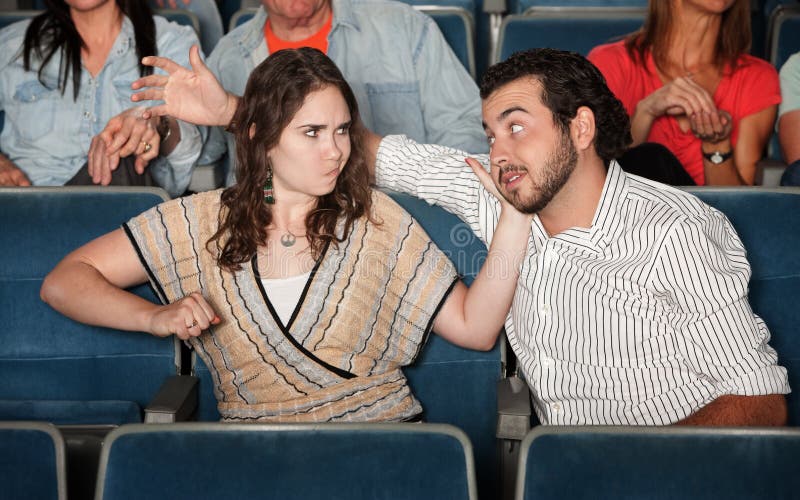 Woman Hits Man in Theater