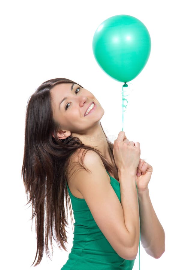 Woman hold green balloon in hands for birthday party. Young happy teenage woman hold green balloon in hands for birthday party smiling on a white background stock photos Woman hold green balloon in hands for birthday party. Young happy teenage woman hold green balloon in hands for birthday party smiling on a white background stock photos