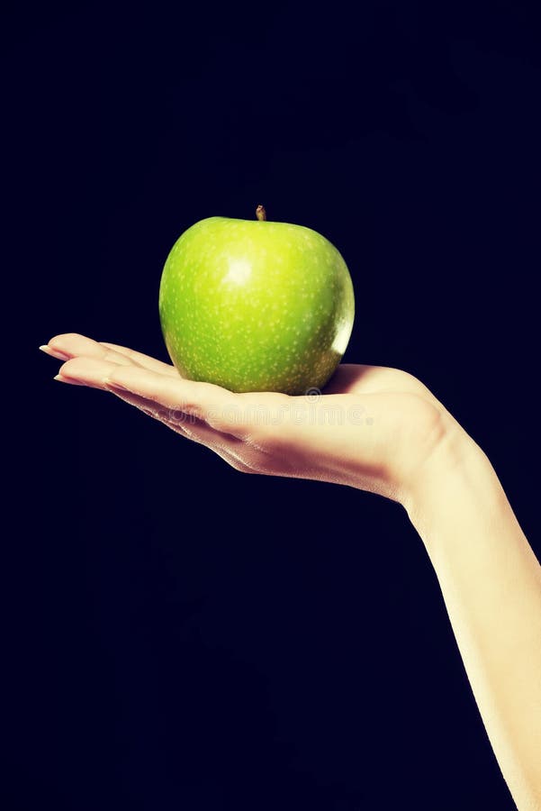 Woman Holding an Apple on Hand. Stock Photo Image of hold, fingernail