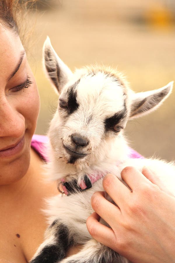 Woman Holding Baby Goat