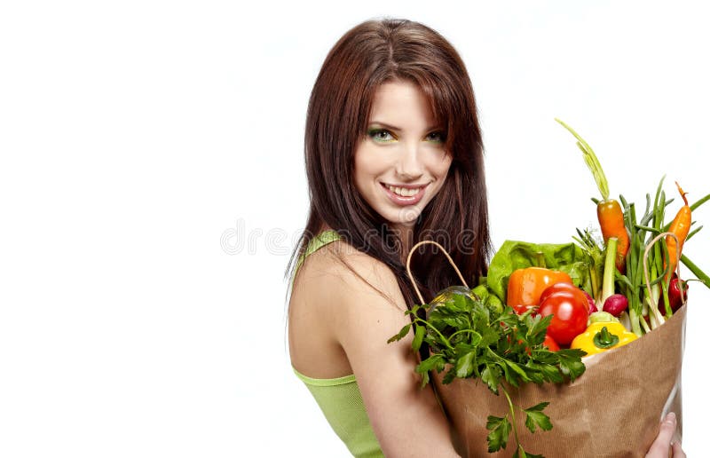 Woman holding bag full healthy food