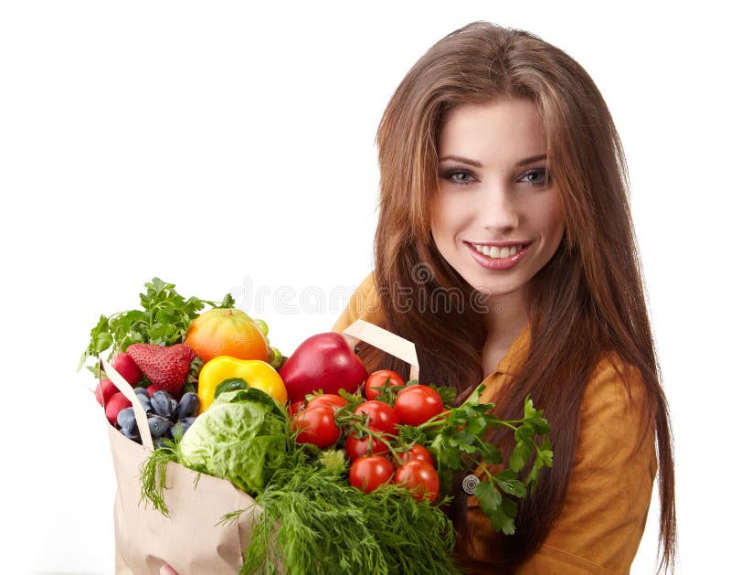 Woman holding a bag full of healthy food