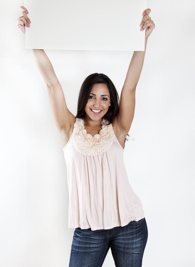 Woman holding a blank white sign royalty free stock photos