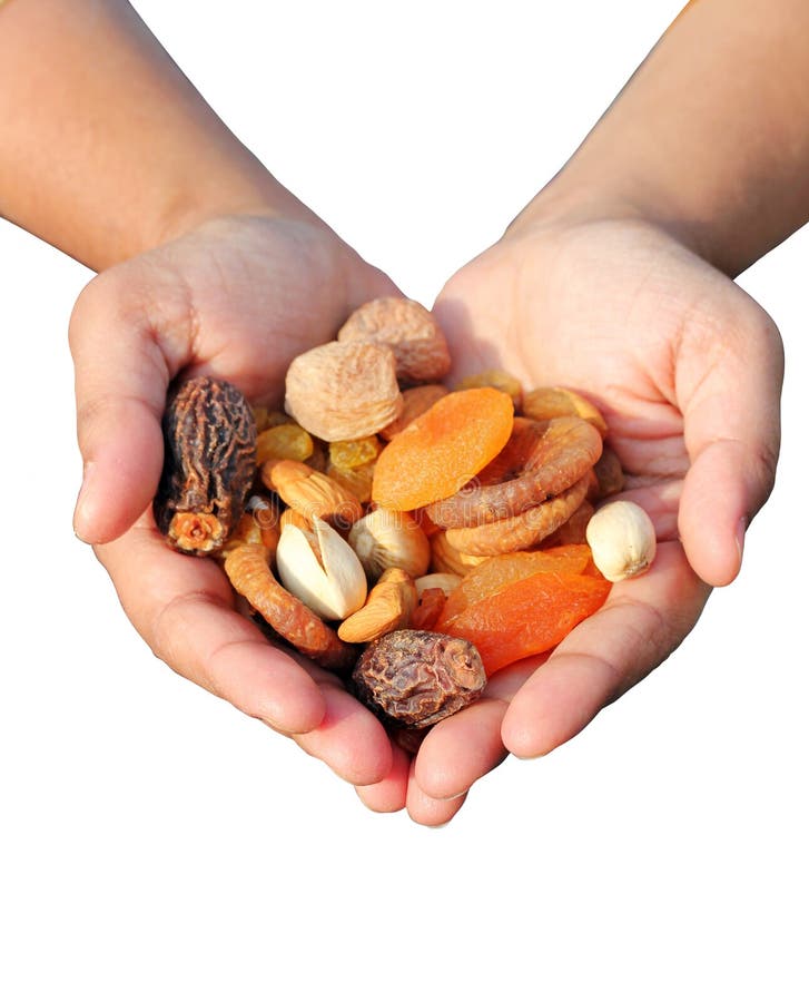 Woman holding bunch of dry fruits isolated