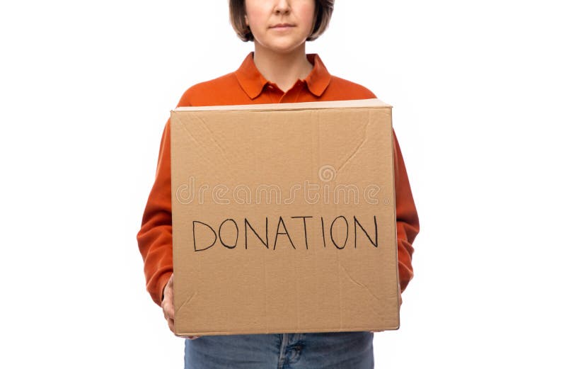 Woman holding cardboard box with donations stock photography