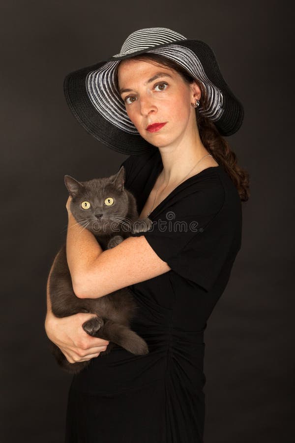 The Woman is Holding the Cat in Her Arms Stock Image Image of felidae