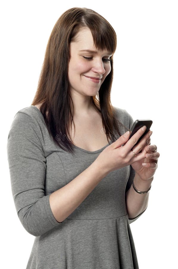 Woman holding a cell phone on white background