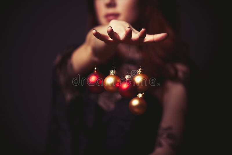 Woman holding christmas decorations