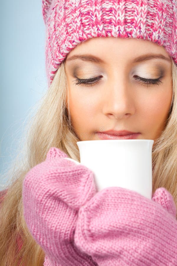 Woman holding cup of drink