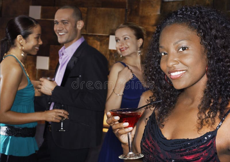 Woman Holding Drink with People at Bar Stock Photo - Image of cocktail, enjoyment: 31836966 Woman Holding Drink with People at Bar Stock Photo - Image of cocktail, enjoyment: 31836966
