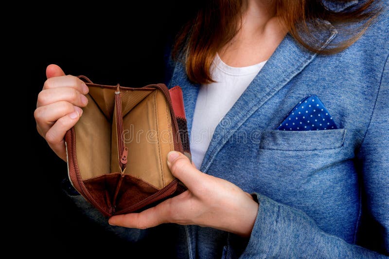 Woman holding an empty wallet, she hasn`t money