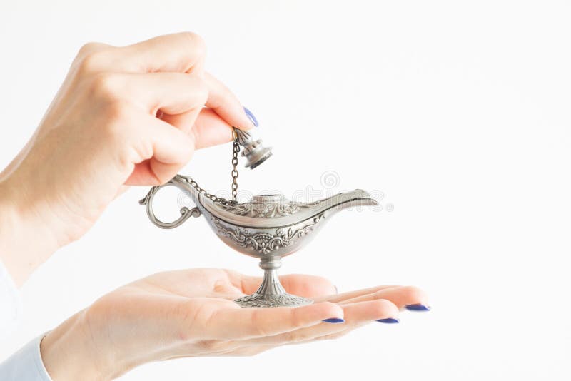 Woman holding genie lamp, hoping for a miracle from the magic spirit