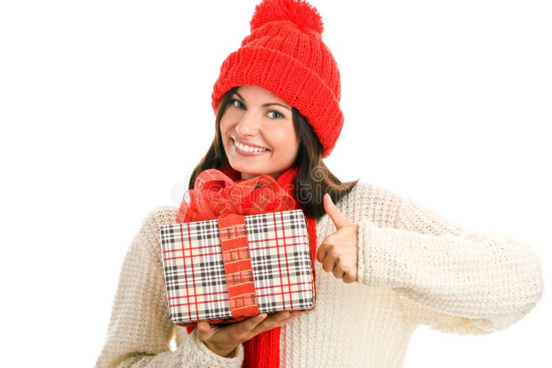 Woman holding gift giving thumbs up