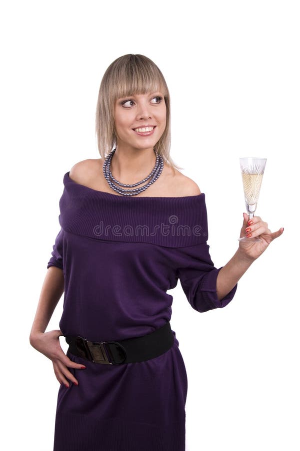 Woman is holding a glass of champagne