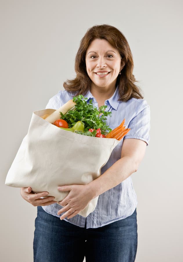 https://thumbs.dreamstime.com/b/woman-holding-grocery-bag-fresh-fruits-6599699.jpg