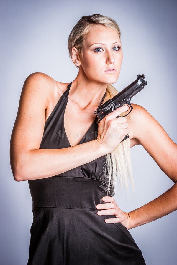 Woman Holding Gun stock image. Image of person, attractive - 95416669