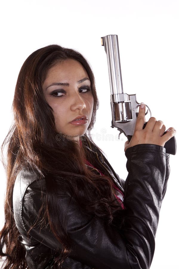 Woman holding gun looking back