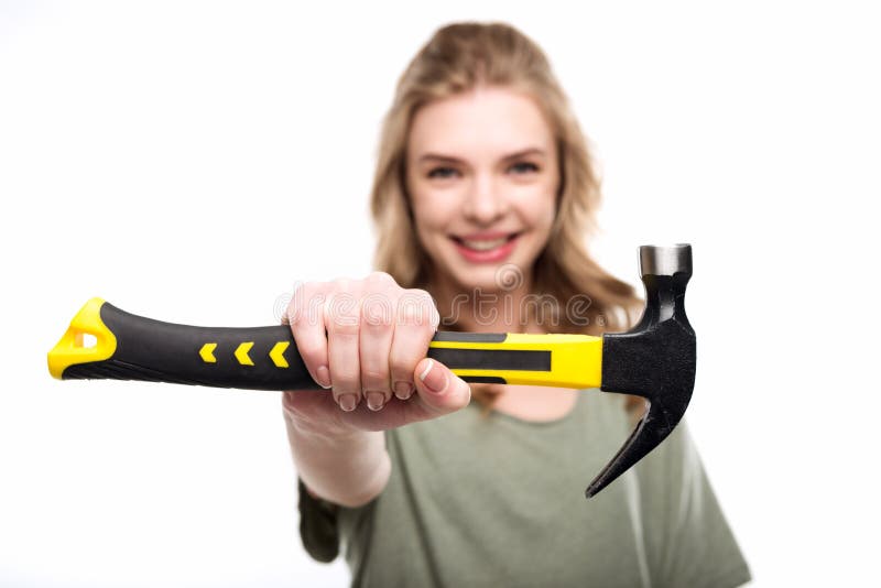 Woman Holding Hammer and Looking at Camera Isolated on White Stock