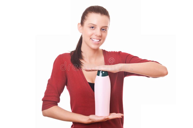 Woman holding in hand shampoo