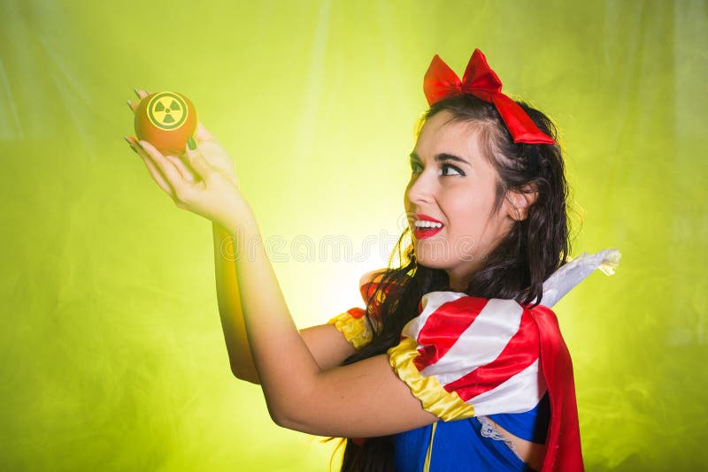 Woman holding hazardous radioactive apple. Nuclear and radiation measurement concept. Woman holding hazardous radioactive apple. Nuclear and radiation stock images Woman holding hazardous radioactive apple. Nuclear and radiation measurement concept. Woman holding hazardous radioactive apple. Nuclear and radiation stock images