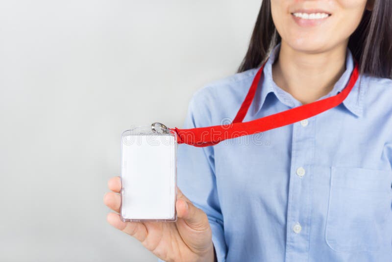 Woman holding Identification card.