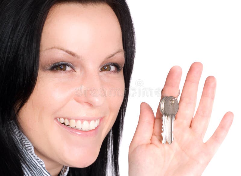 Woman holding keys over white royalty free stock images