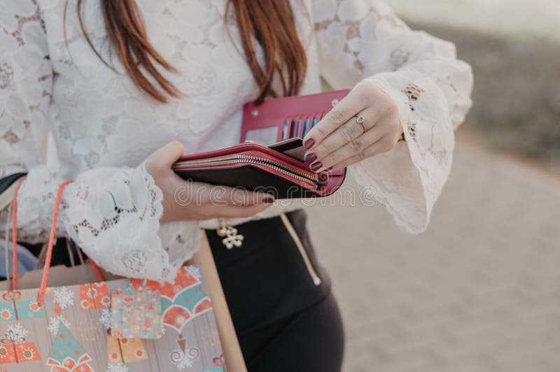 Woman holding a leather purse