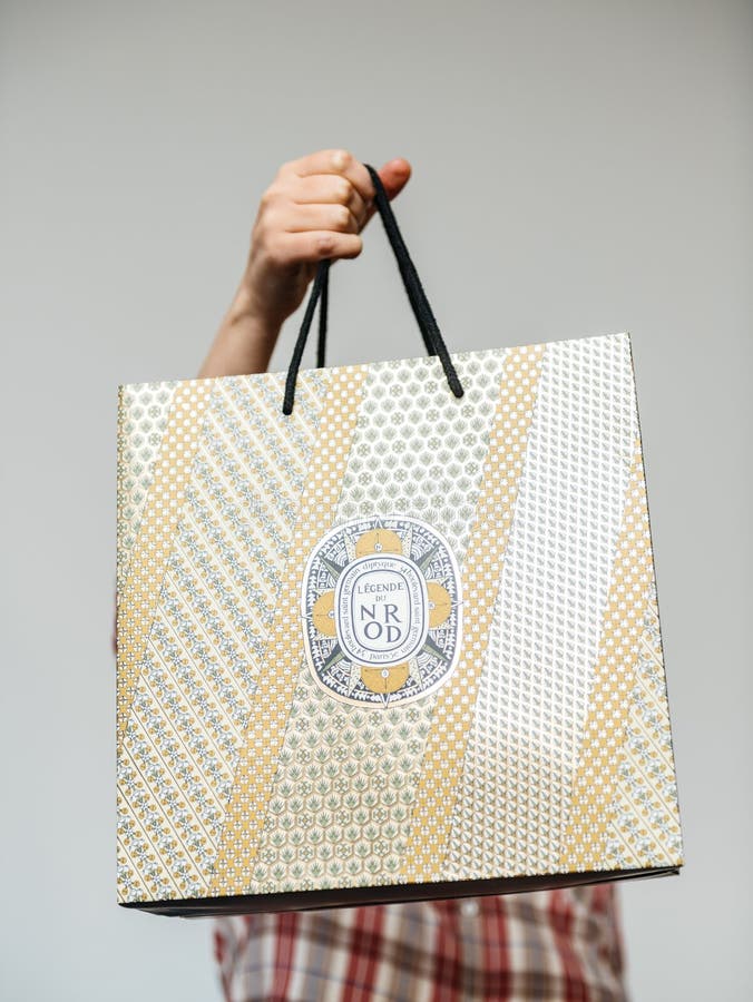 Woman Holding Luxury Golden Bag from Diptyque Paris Editorial Stock ...