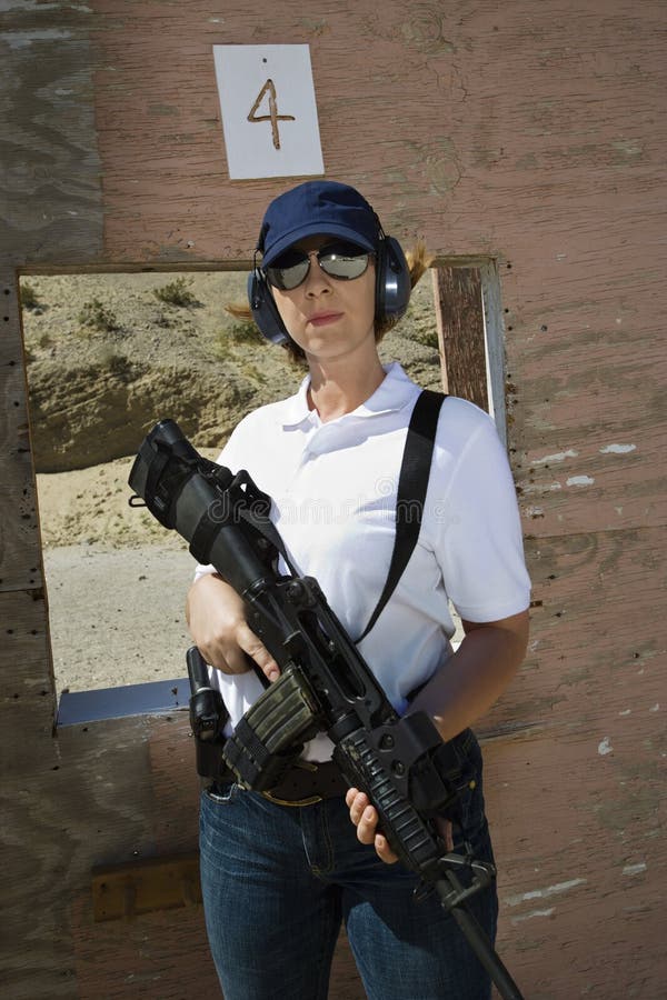 Woman Holding Machine Gun At Firing Range
