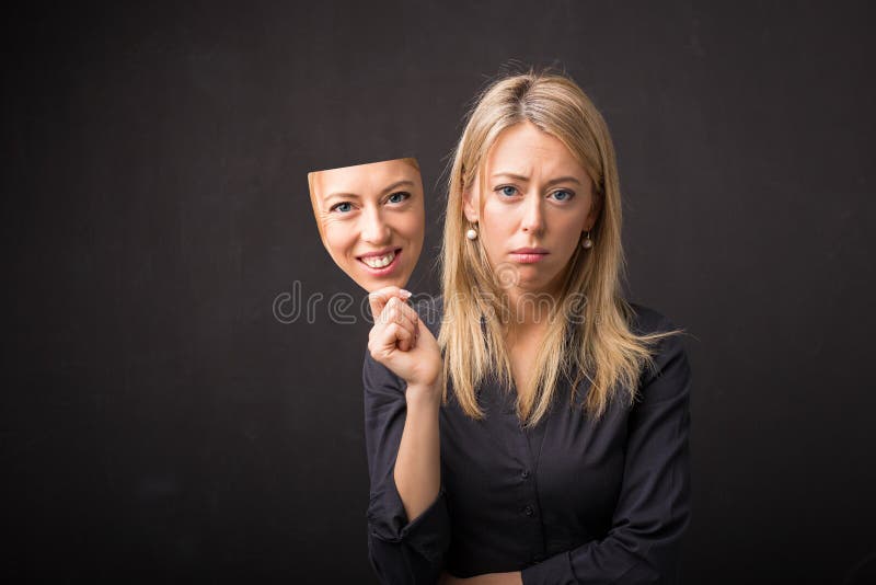 Download A Woman Holding A Sad Face On Her Face