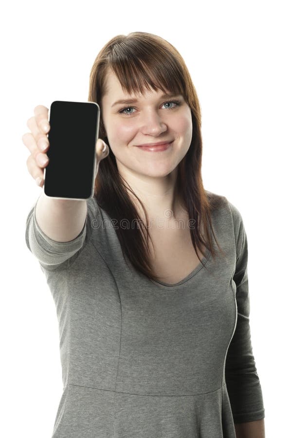 Woman holding out a cell phone on white background