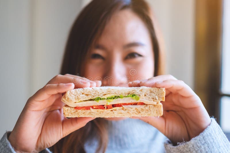 A Young Stylish Girl Smiles Gently and Shows Her Thumb Up, Meaning that Her  Sandwich is Very Tasty, and You Should Try Stock Photo - Image of  lifestyle, american: 118096764