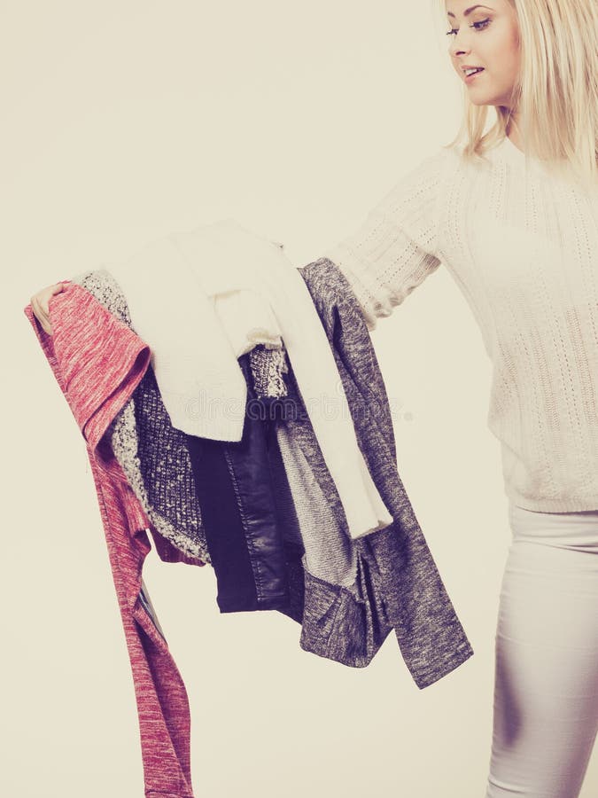 Woman Holding Pile of Winter Clothes Stock Image - Image of choose ...