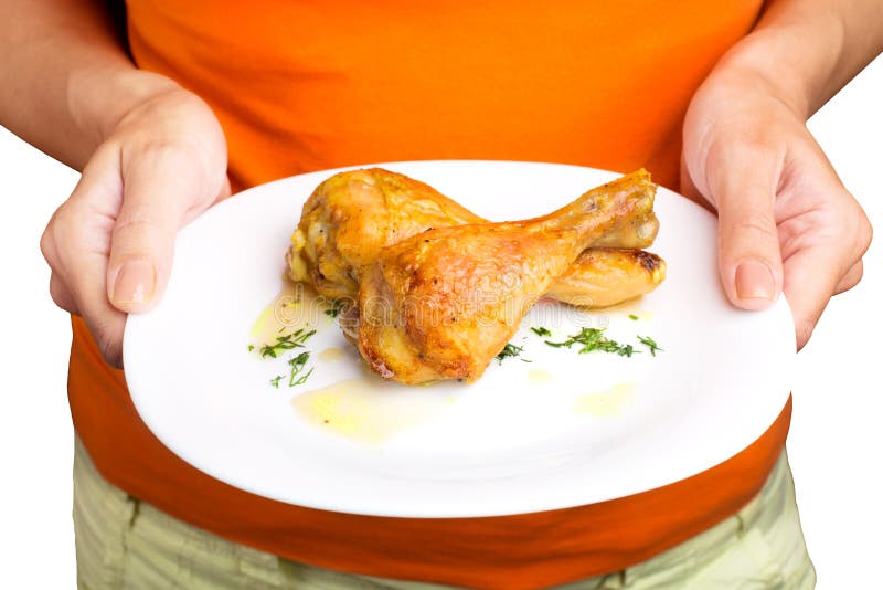 Woman holding plate with chicken legs royalty free stock photos Woman holding plate with chicken legs royalty free stock photos