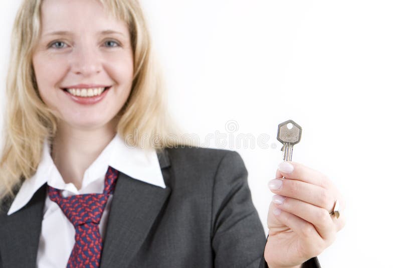 A Woman Holding a Silver Key Stock Image - Image of confident, smile ...