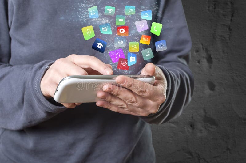 Woman holding a tablet with modern colorful floating apps and icons. Selective focus. Woman holding a tablet with modern colorful floating apps and icons. Selective focus.