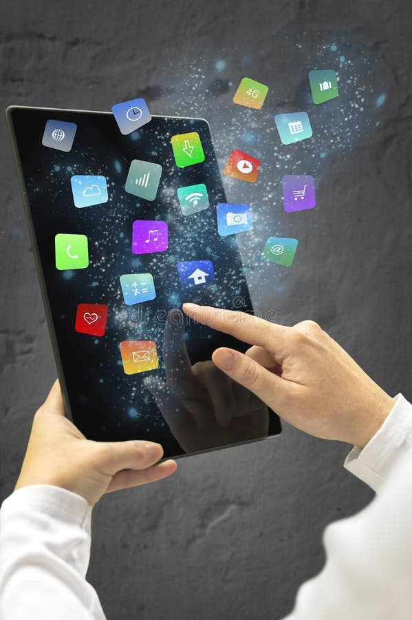 Woman holding a tablet with modern colorful floating apps and icons. Selective focus.