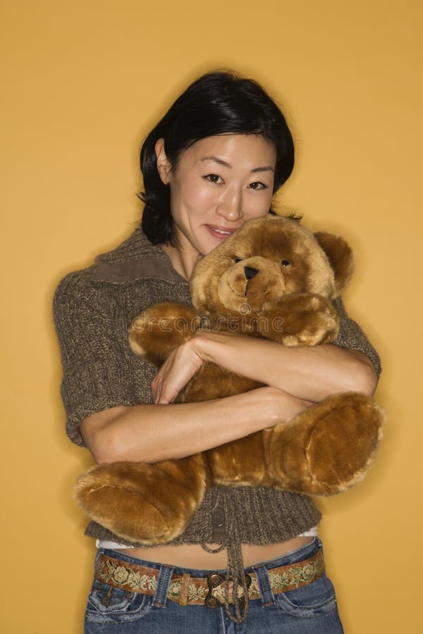 Woman holding teddy bear. stock photo. Image of woman 2432022