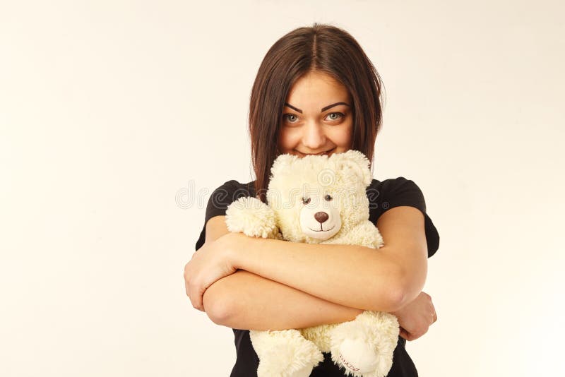 Playful Woman Holding Teddy Bear Stock Photo - Image of blond, isolated: 18807044