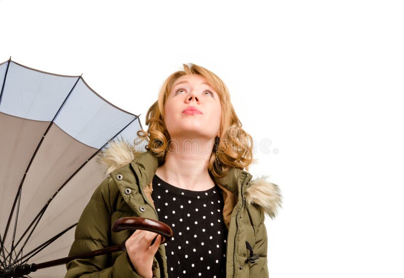 Woman holding umbrella looking at